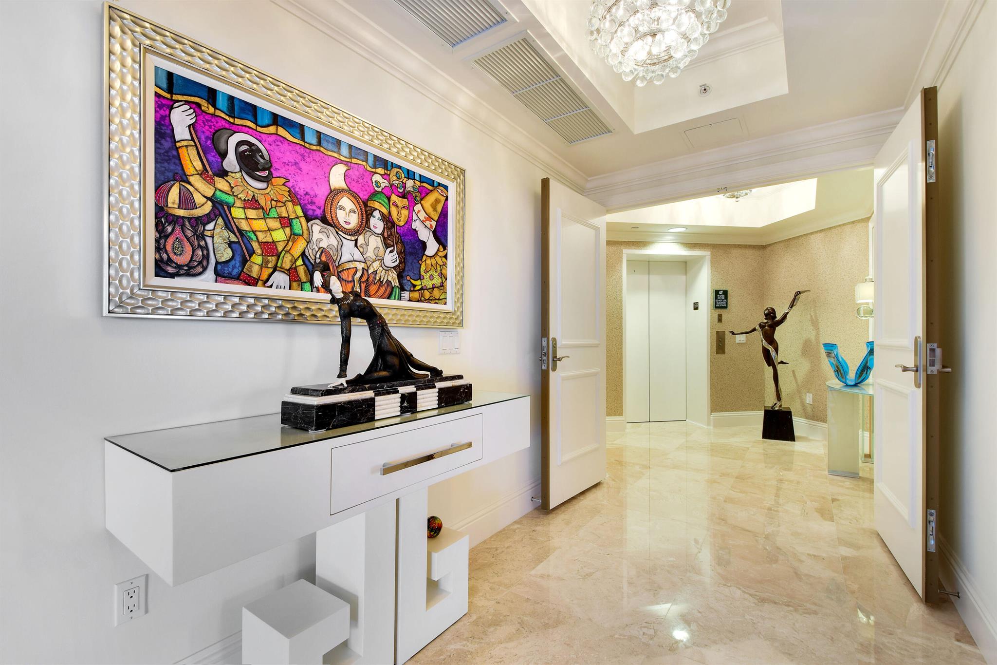 This STUNNING 2 bed+Den/3.5 bath condo offers the best of both worlds with ocean AND Intracoastal views! Den can be used as a 3rd bedroom & contains a full bathroom + closet. Located in Singer Island's most prestigious and exclusive building, Ocean's Edge, with only 40 residences. This boutique building delivers private oceanfront living AND resort-style amenities with luxurious decor and design throughout! A private elevator leads directly to your foyer allowing for a grand and sophisticated entrance into the residence. The great room with floor to ceiling windows bathes everything in natural light and water views from every angle! Your master suite has a spacious wraparound balcony which provides sunrise to sunset views, PLUS the sparkling city skyline of West Palm Beach in the evenings