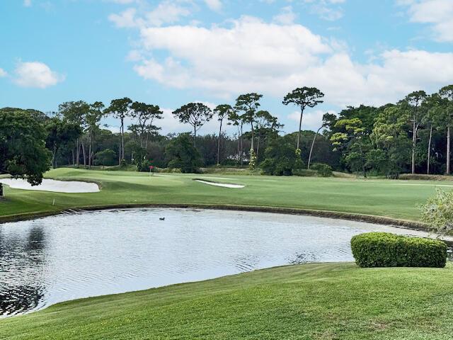 With a spectacular picture-perfect view of the lake and golf course, this fully renovated second-floor condo is currently under construction which is nearly complete. The residence will feature 3 bedrooms, 2.5 bathrooms, and a custom designer chef's kitchen with Cafe appliances, abundant cabinet and storage space, and a wine cooler. High-end finishes include 48'' x 48'' porcelain tile flooring, impact windows and doors, LED lighting, and backlit and front-lit mirrors in the bathrooms. The home also offers the convenience of a private interior elevator, LG washer and dryer, 2024 roof, and a 2017 AC unit.