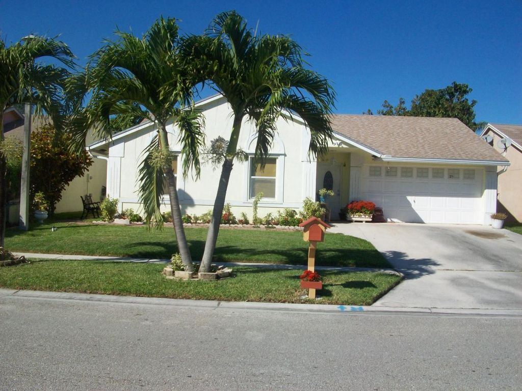 Photo of 5419 Blueberry Hill Avenue, Lake Worth, FL 33463 (MLS # R11089299)