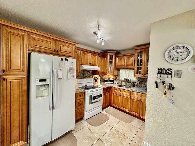 55 + Age Community. SEASONAL RENTAL. COMFORTABLE 2BR/2BA (1,170 SF) Par 3 Golf View. Updated open kitchen features rich cabinetry, raised ceiling, granite counters. backsplash & snack counter. 18" porcelain tile throughout. Updated master bath shower. 2nd bedroom includes Murphy bed. RENT INCLUDES water, and basic cable, internet. Conveniently close to Gate B, 24 hr guard gated. FREE golf (except cart fees) on two 18 hole courses (PGA & Par3); Amenities include Restaurant, Billiard Room, Bbq/Picnic Area, Clubhouse, Courtesy Bus, Exercise Room, Heated Pool, Library, Putting Green, Sauna, Shuffleboard,Tennis, Pickle Ball, Vehicle Wash Area, Electric Car Charging Station. Close to shopping, dining & highways. 15 min. to the beach. PERFECT SEASONAL RENTAL!