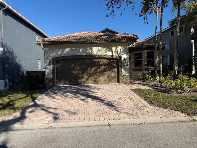 Photo of 1212 Rosegate Boulevard, Riviera Beach, FL 33404 (MLS # R11161574)