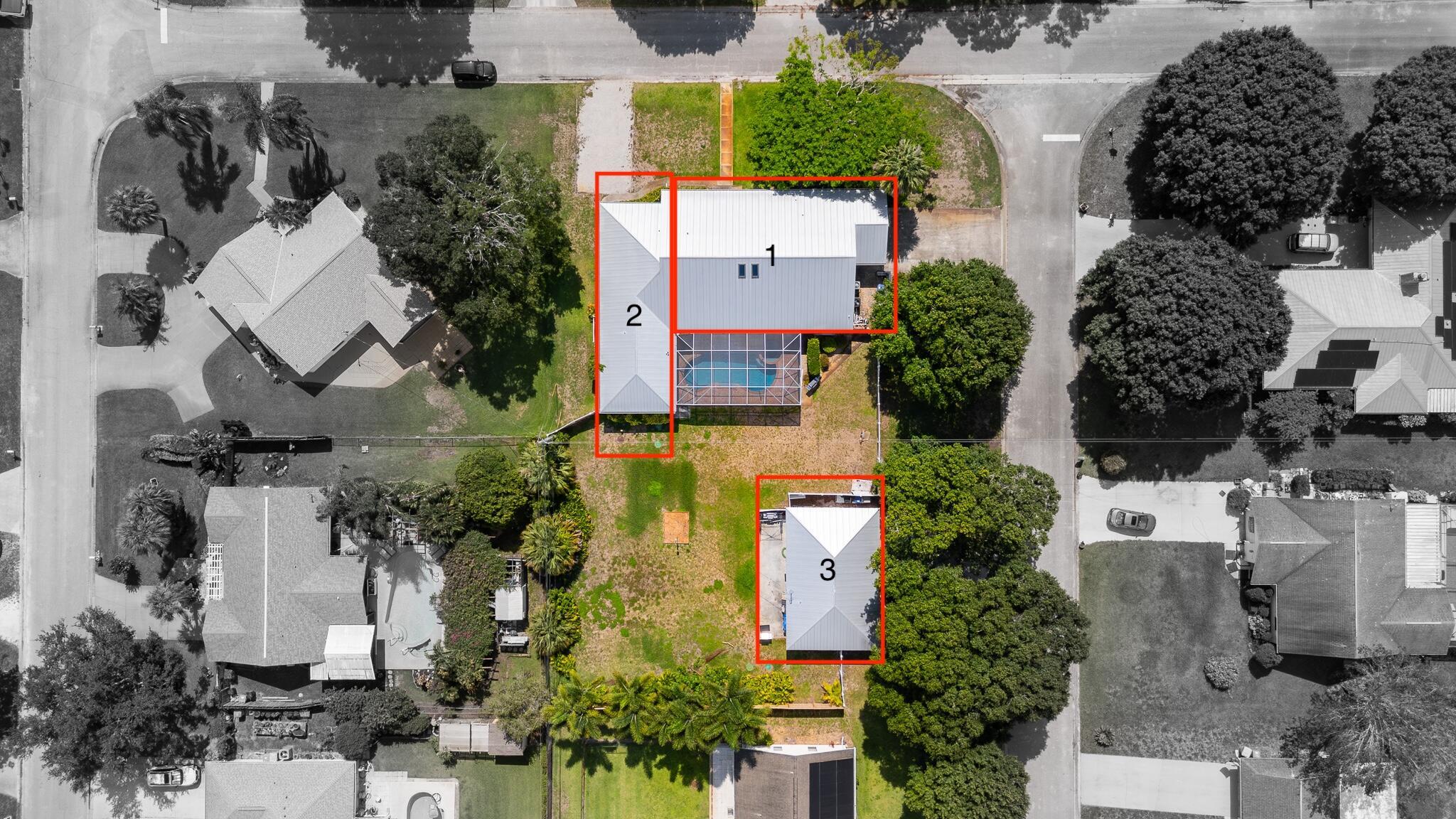 3 Homes in 1 - The Ultimate Multi-Generational Compound! Welcome To the Most Unique and Versatile Property on the Market! Situated on a Generous Half-Acre Lot with a Pool, This Incredible Vero Beach Compound Offers 3 Separate Living Spaces--Perfect for Extended Family, Guests, or Income Opportunities. The Main House Has 3 Bedrooms, 2 Bathrooms, and a Private Office. Attached Via a Private Entrance is a Spacious 2-Bedroom, 2-Bathroom In-Law Suite. Completing The Setup Is a Fully Detached 1-Bedroom, 1-Bathroom Guest House, Offering Endless Flexibility. This Property Is Loaded with Updates, Including Newer Roofs, Appliances, Flooring, and More--Making It Truly Move-In Ready. Enjoy The Ease of 3 Separate Driveways, 2-Car Garage, and Plenty of Parking Space for Visitors, RVs, or Boats.