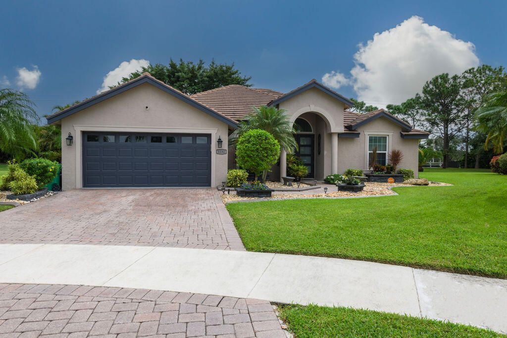 Photo of 1232 SW Briarwood Drive, Port Saint Lucie, FL 34986 (MLS # R10926947)