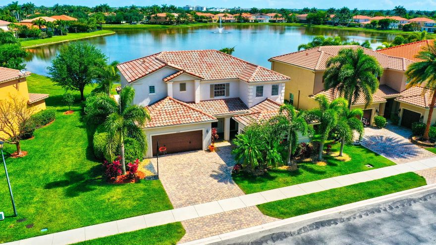 Welcome to Oakmont Estates. This home has a stunning lake view to relax by or you can entertain your guests on the travertine paved XL patio. Tall ceiling in living room upon entry. Conveniently offers a 1 bedroom and full bath on main level. Well cared for and maintained, has a large kitchen with pantry. Primary bedroom has a super large closet, a must see. Electric Vehicle 220V outlet in garage. ( top part/charger  does not convey, owned by FPL and associated with customer acct.) 
Oakmont Estates offers many amenities for your enjoyment including Fitness center, pool, tennis and much more!