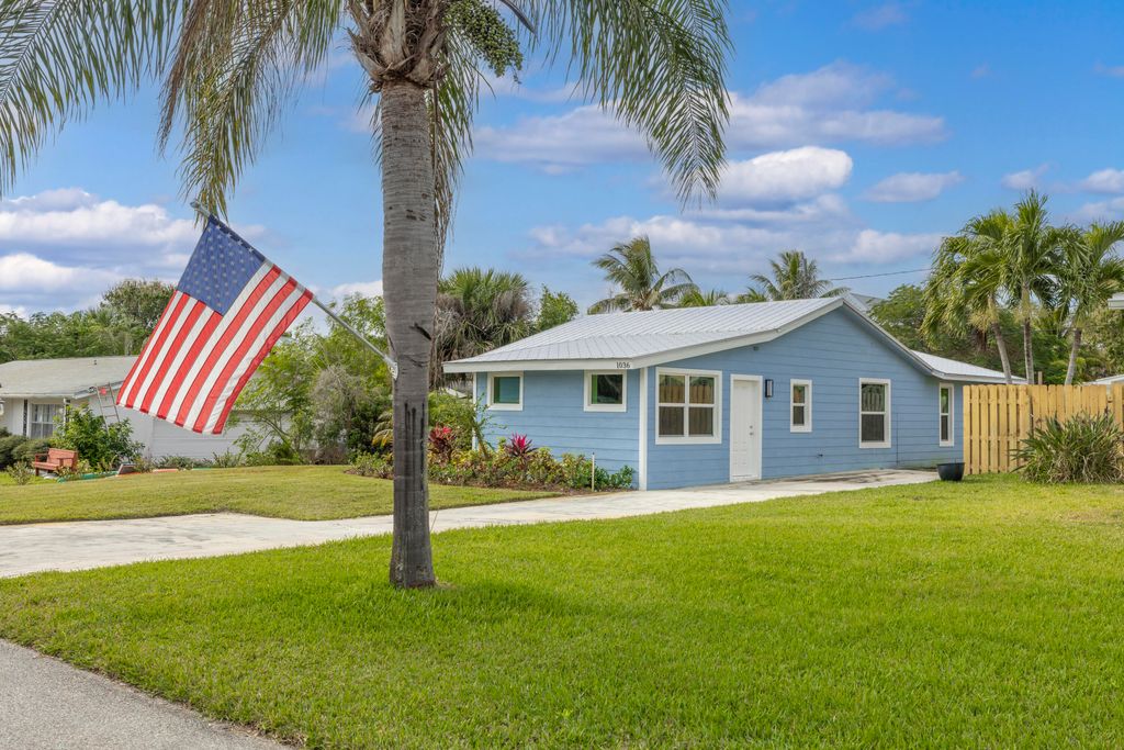 Photo of 1036 NE Wright Avenue, Jensen Beach, FL 34957 (MLS # B26005815)