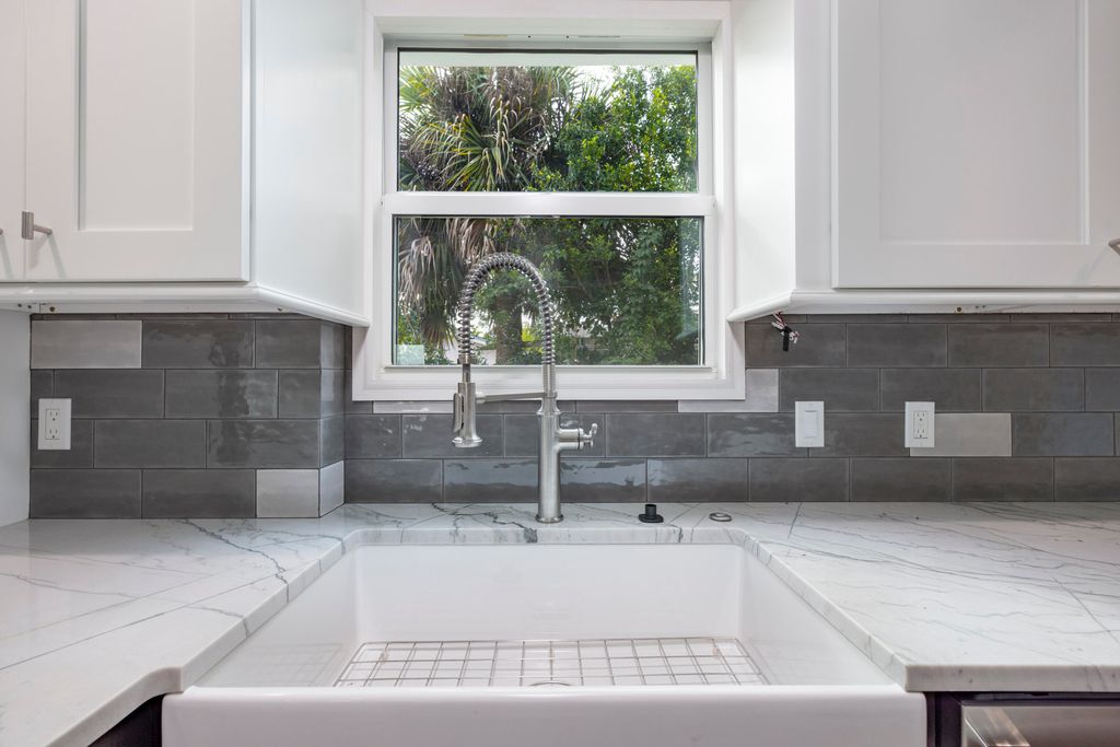 Photo of 1036 NE Wright Avenue, Jensen Beach, FL 34957 (MLS # B26005815)