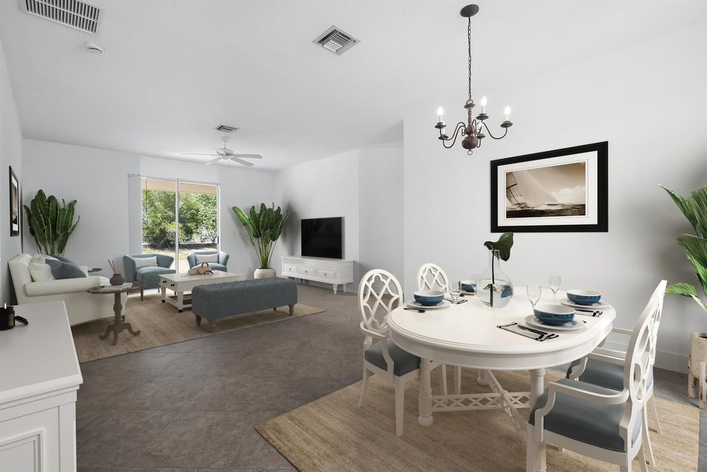 Photo of 565 SW Feldman Avenue, Port Saint Lucie, FL 34953 (MLS # R11133588)