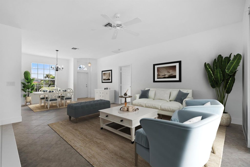 Photo of 565 SW Feldman Avenue, Port Saint Lucie, FL 34953 (MLS # R11133588)