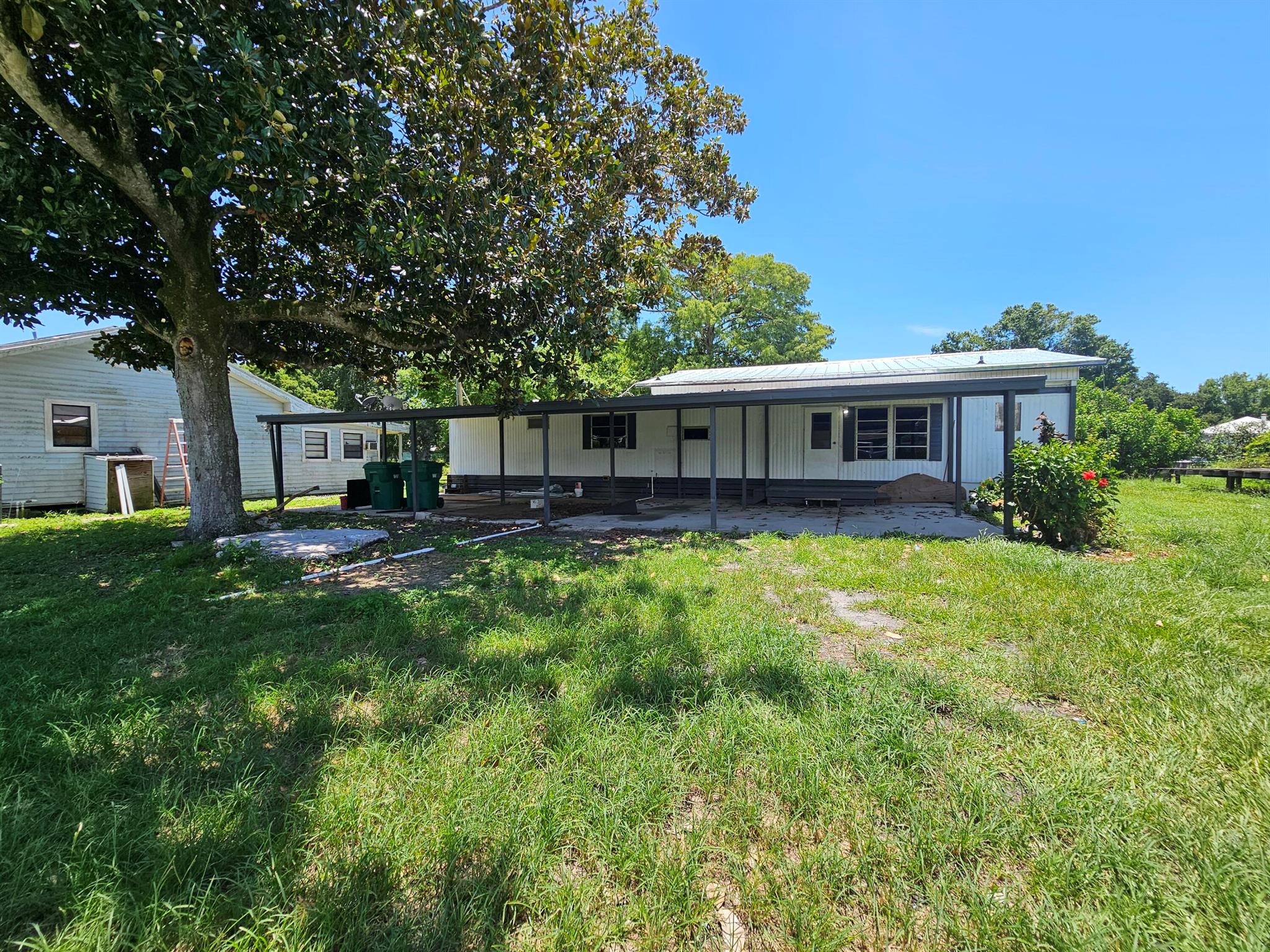 Treasure Island~Affordable waterfront living with access to desirable Lake Okeechobee and no HOA! This 4Bed/2Bath Manufactured Home features a brand-new metal roof and is on public water and septic. Located in a great area, it's perfect for first-time buyers or investors. Enjoy peaceful water views, excellent fishing and boating, and tons of potential. Priced to sell. Measurements are approximate.