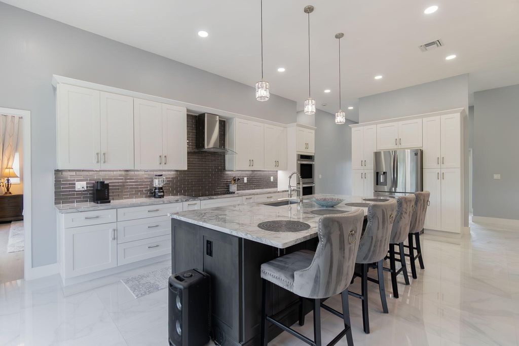 Photo of 13621 Barberry Drive, Wellington, FL 33414 (MLS # B26024366)