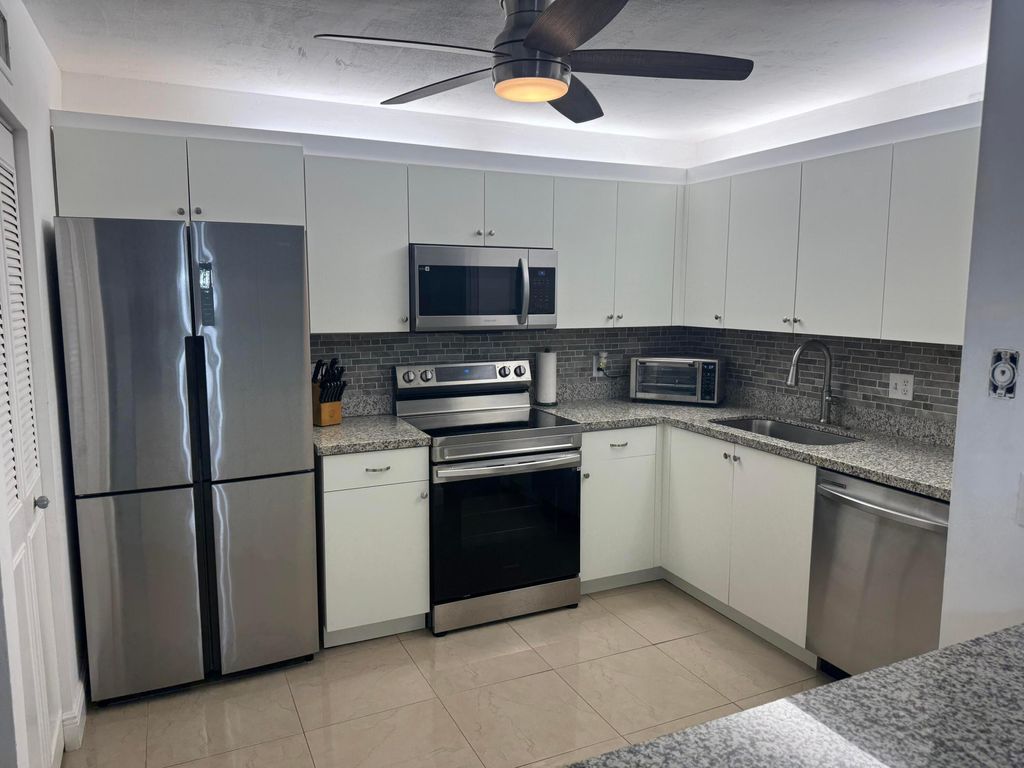 Photo of 5817 La Pinata Boulevard #C-1, Greenacres, FL 33463 (MLS # B26018397)