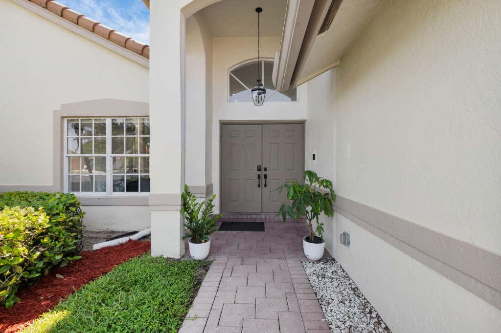 Photo of 6000 Golf Villas Drive, Boynton Beach, FL 33437 (MLS # R11091498)