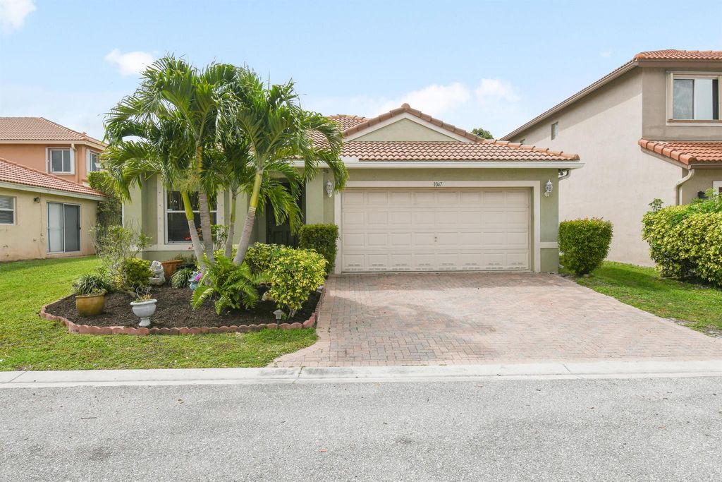 Photo of 1047 Big Torch Street, Riviera Beach, FL 33407 (MLS # R10965230)