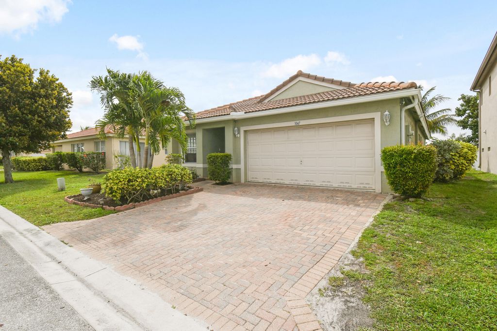 Photo of 1047 Big Torch Street, Riviera Beach, FL 33407 (MLS # R10965230)