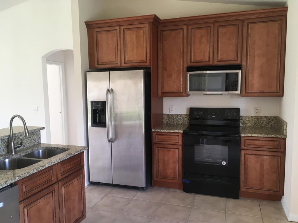 Photo of 632 SW Granadeer Street, Port Saint Lucie, FL 34983 (MLS # B26025806)