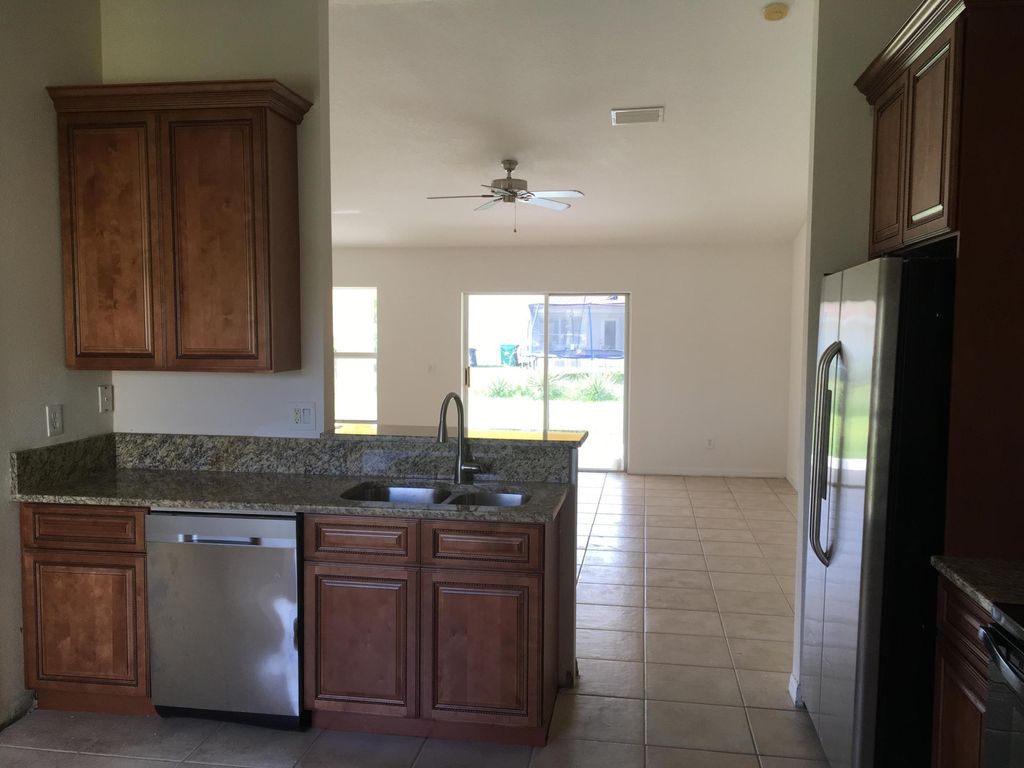 Photo of 632 SW Granadeer Street, Port Saint Lucie, FL 34983 (MLS # B26025806)