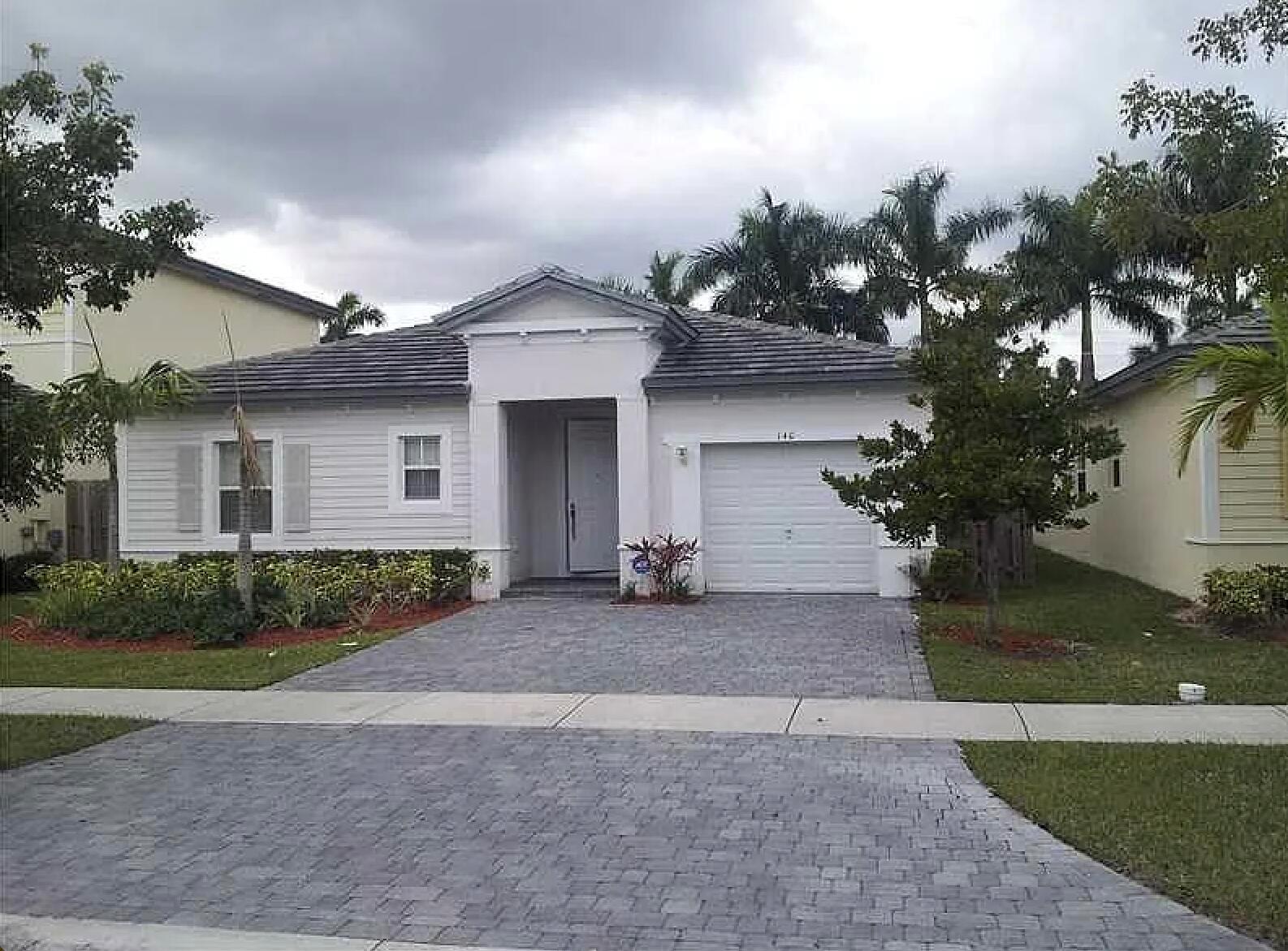 Discover this spacious 3-bedroom, 3-bathroom single-family home in a desirable gated community in Homestead, Florida. With 1,889 sq ft of living space all on one level, this home features a formal dining room, generous living area, and a dedicated laundry room. Enjoy peaceful canal views from your private backyard. The home also includes an attached garage and access to community amenities such as a pool, exercise room, and low HOA fees. A perfect blend of comfort, convenience, and lifestyle.