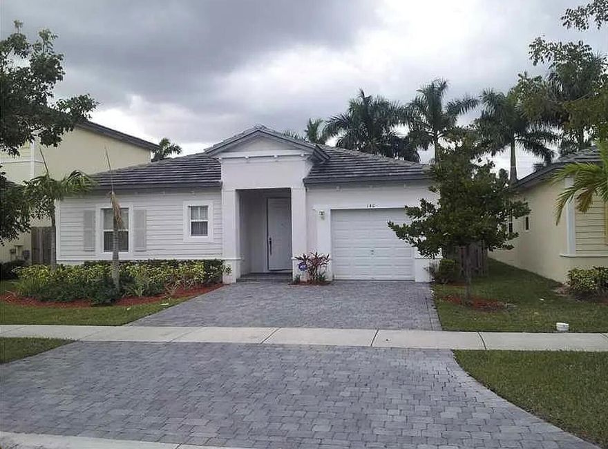 Discover this spacious 3-bedroom, 3-bathroom single-family home in a desirable gated community in Homestead, Florida. With 1,889 sq ft of living space all on one level, this home features a formal dining room, generous living area, and a dedicated laundry room. Enjoy peaceful canal views from your private backyard. The home also includes an attached garage and access to community amenities such as a pool, exercise room, and low HOA fees. A perfect blend of comfort, convenience, and lifestyle.