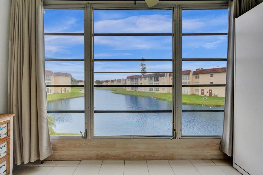 Discover your dream home in Sunrise Lakes.  This beautifully updated unit features 1 bedroom and 1 bathroom, with stunning lake views. Highlights of this home include an updated kitchen and bathroom, stainless steel appliances, laminate and ceramic tile flooring, and an enclosed patio. Murphy bed on enclosed patio is the perfect place for guests.  Internet and cable are included in the monthly fee. This unit comes fully furnished, making it move-in ready. See this incredibly well-kept unit with the best lake view in the community today.