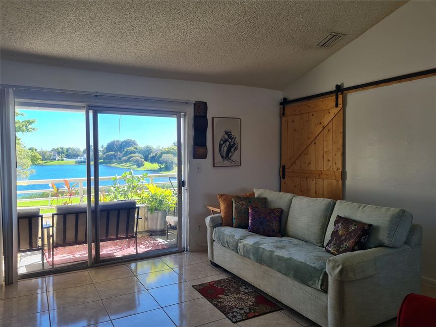 Gorgeous, airy 875 sq ft apartment! Start your mornings with stunning lake views right from your private balcony 
Inside, you'll love the sense of space and light created by vaulted ceilings throughout. Remodeled kitchen, featuring sleek, white quartz countertops and beautiful cabinetry. Plus, the convenience of having your own in-unit laundry can't be beat! The spacious bedroom can accommodate a king size bed and there is a walk in closet.
Located in a desirable gated community, you'll have access to nice amenities including a refreshing community pool and a well-equipped gym. Outdoor enthusiasts will love the scenic jogging path around the lake, and there's even dedicated RV and boat parking available!