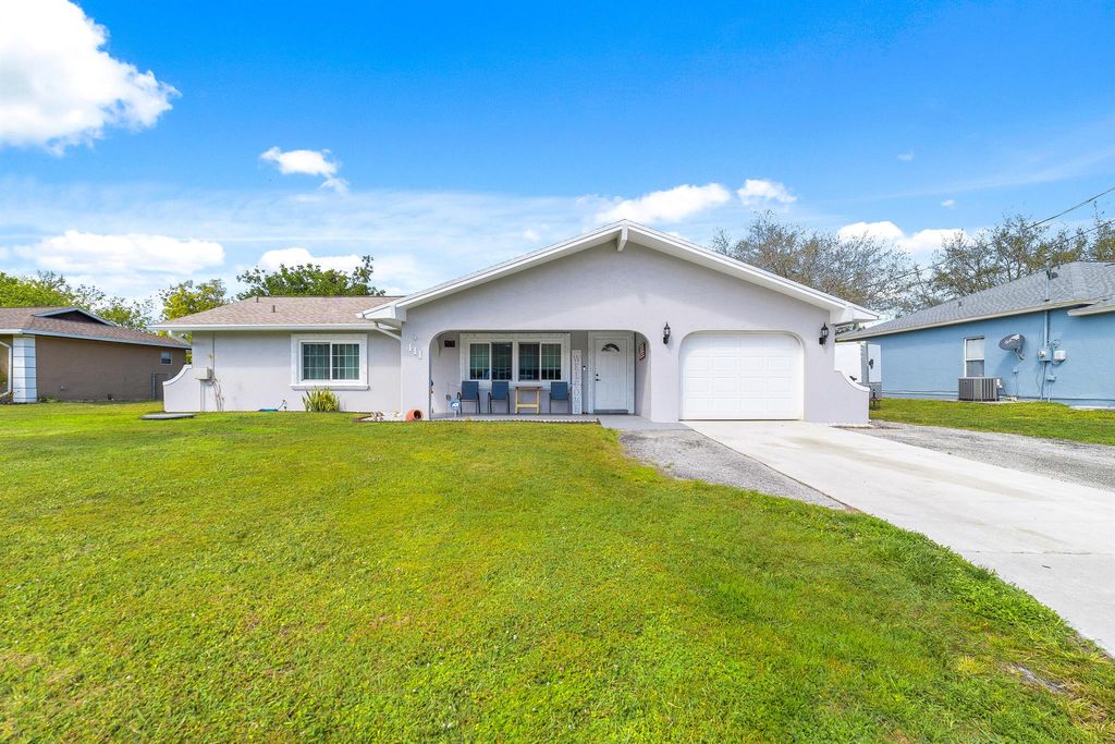 Photo of 411 SW Lucero Drive, Port Saint Lucie, FL 34983 (MLS # R10964026)