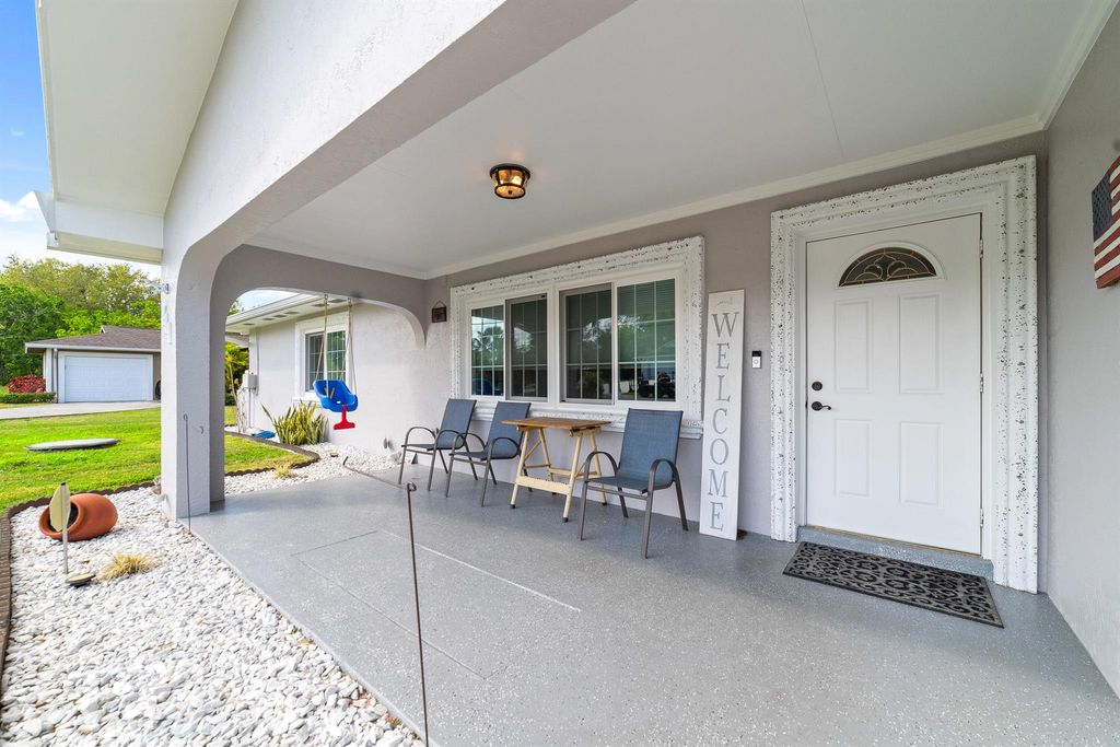 Photo of 411 SW Lucero Drive, Port Saint Lucie, FL 34983 (MLS # R10964026)