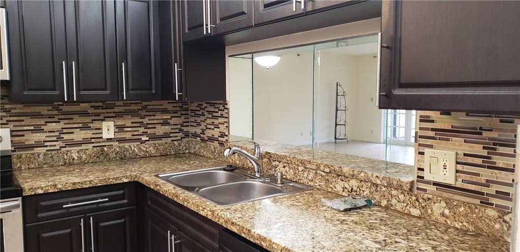 Photo of 7050 NW 44TH Street #403, Lauderhill, FL 33319 (MLS # B26065387)
