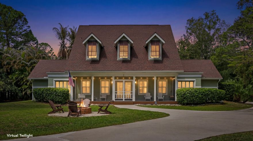 Discover your peaceful retreat in Jupiter Farms—a stunningly remodeled two-story home on 1.25 fenced acres. Featuring impact windows and doors on the first floor and detached garage for hurricane protection. Inside offers bright open-concept living ideal for families. Outside enjoy a resort-style pool with tumbled marble deck and lush landscaping, plus a tiki outdoor kitchen with granite bar, grill, pizza oven, sink, fridge and seating for 12. Includes screened front patio, fire pit, air-conditioned detached garage with livable potential and 30 & 50-amp hookup pad for boat or RV. Minutes from beaches, boating, shopping, fine dining, and great schools. Don't miss this Jupiter Farms gem.