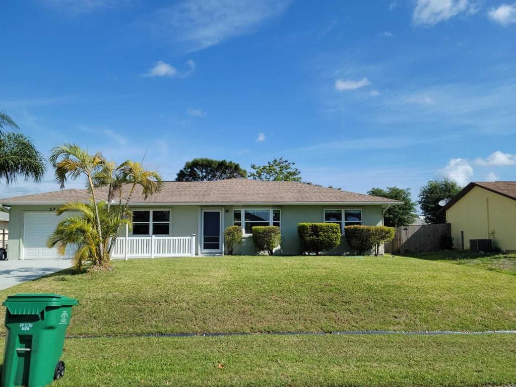 Photo of 585 SW Ester Avenue, Port Saint Lucie, FL 34983 (MLS # R10788560)