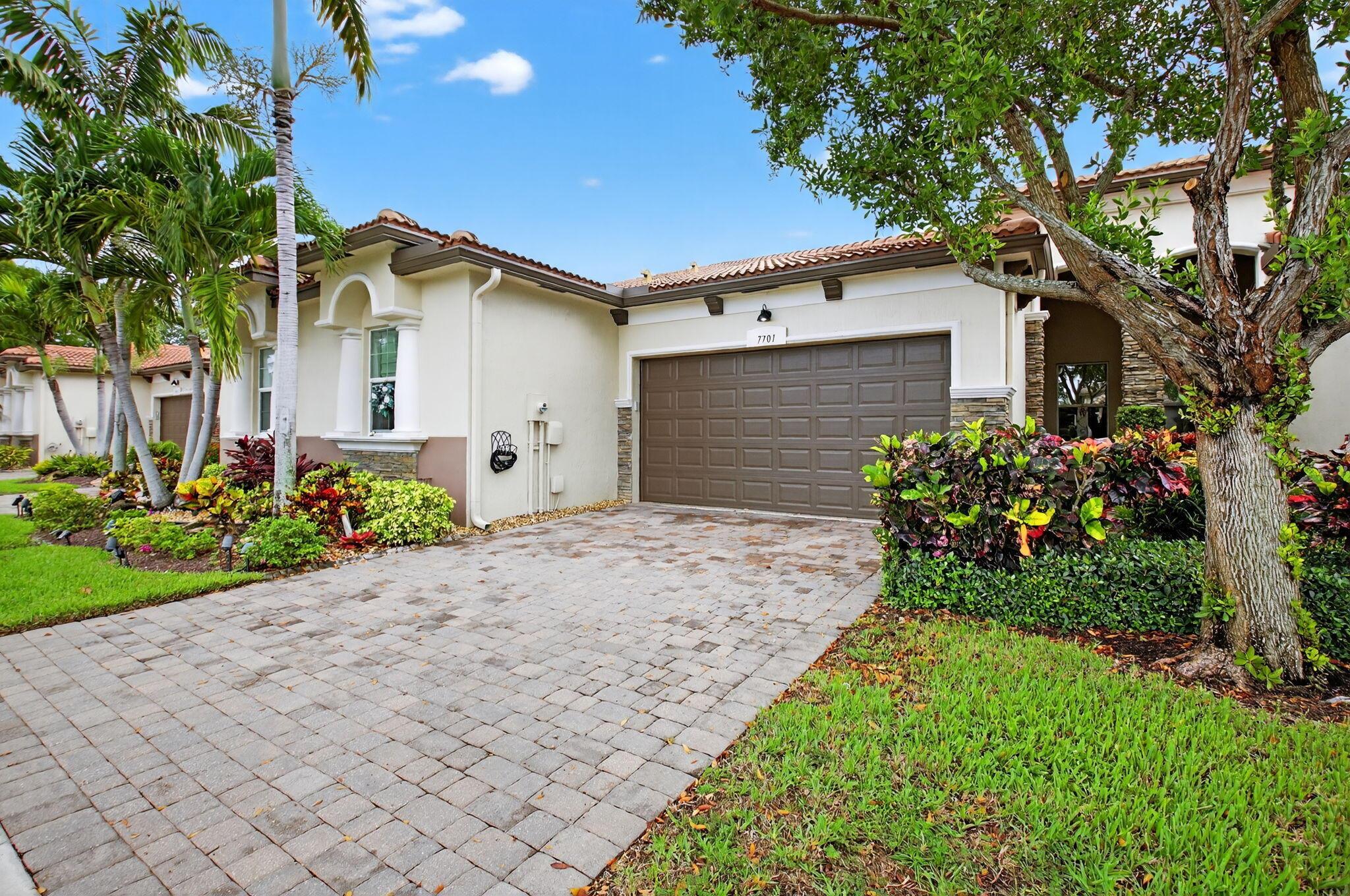 This fantastic ''Florenza'' 2 bedroom 2 bath plus den, 2-car garage patio villa is the most requested model. This truly open concept home does not disappoint.Mahogany kitchen cabinets, granite counter tops with extended island, cabinet pull outs, stainless steel appliances with double oven range, 20x20 ceramic tile floors throughout, etched glass front and lanai doors, double sinks and free standing shower in primary bath, walk in closet in primary, epoxy garage floor, added gutters in back of home and extended screened lanai on private lot. Villaggio Reserve is a sought-after active 55+ community with a 38,000 sq ft clubhouse, lap pool, resort style pool, kiddie pool, jacuzzi, cafe, fitness room and classes, 6 pickle ball courts, 5 tennis courts and 2 bocce ball courts.