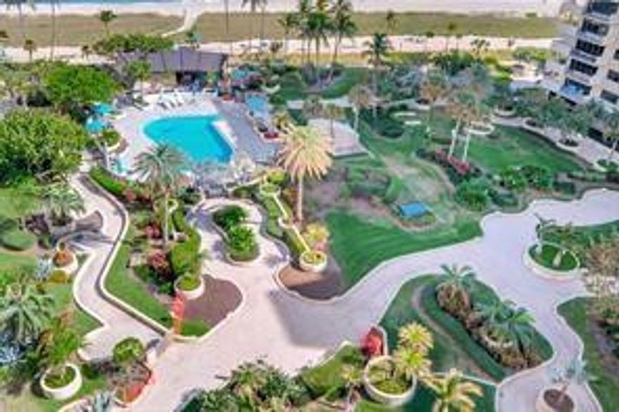 New price! Unobstructed oceanfront living! This rare, semi-private elevator unit is an unparalleled value and priced to sell immediately.  Step into a move-in ready home, freshly painted with new carpeting throughout. The spacious 2 bedroom, 2 bath floorplan includes not only a panoramic direct ocean view, but also a view of the beautiful expansive gardens, This is more than a home--it's resort style living at its best, with top tier amenities,  including three heated pools, professional grade gym,  tennis and pickleball courts, EV charging stations and 24 hour staffed front desk. An added bonus with this unit is two garage parking spaces, plus additional  storage. The major special assessment for the ongoing concrete restoration has been fully paid!
