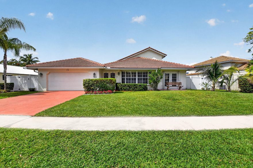 WOW—What a view! This light-filled lakefront pool home offers 4 bedrooms plus den, 2.5 baths, and a spacious layout designed for comfortable South Florida living, all set within the highly desirable Camino Lakes neighborhood in East Boca Raton.  From the moment you enter, you'll appreciate the soaring vaulted ceilings and open, airy feel, with natural light pouring in and beautiful lake views creating a serene backdrop. The home offers  a large primary suite with built-in closets one the first floor, and well-maintained finishes throughout. The kitchen is both functional and inviting with under-cabinet lighting, glass cooktop, and a convenient planning desk. Step outside to your private backyard retreat, where a sparkling pool with spa overlooks tranquil water views—perfect for relaxing or entertaining.  Camino Lakes is known for its quiet streets, central East Boca location, and close proximity to everything that makes this area so desirable. Just minutes to downtown Boca, pristine beaches, top-rated A+ schools, and convenient shopping and dining—including nearby Mizner Park and Town Center at Boca Raton.  FEATURES & UPDATES  INTERIOR  Vaulted ceilings with abundant natural light Spacious open layout with lake views Oversized marble tile flooring throughout main living areas Pergo flooring in bedrooms 2, 3 & 4 Updated bathrooms Large primary suite with custom built-in closets Eat-in kitchen with: Under-cabinet lighting Glass cooktop Built-in planning desk Move-in ready condition  EXTERIOR  Private pool overlooking serene lakefront setting Beautiful backyard space ideal for entertaining or relaxing Quiet street in desirable East Boca neighborhood.  - Brand New HVAC Unit 2026 - Dishwasher replaced 2026 - Upstairs HVAC Unit 2024 - Hurricane Impact Sliding Glass Doors x 5 - Updated Half Bath - Outdoor Pergola 2023 - New Salt Water System Pool and Spa With Automation 2022 - Pool Heater 2022 - Travertine Patio 2022 - Fenced in yard - Plantation shutters - Kitchen cabinets painted - Indoor/outdoor security cameras.