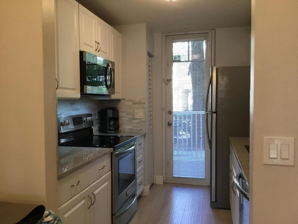 Photo of 4775 Chancellor Drive #11, Jupiter, FL 33458 (MLS # R11111647)