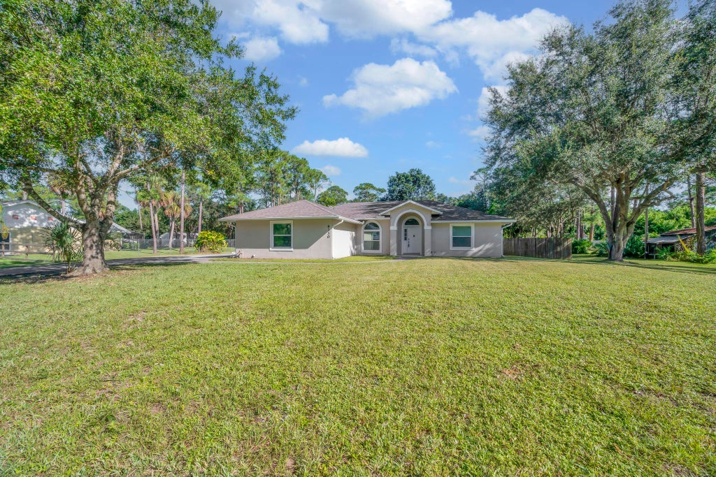 Photo of 8330 Hidden Pines Road, Fort Pierce, FL 34945 (MLS # B26079348)