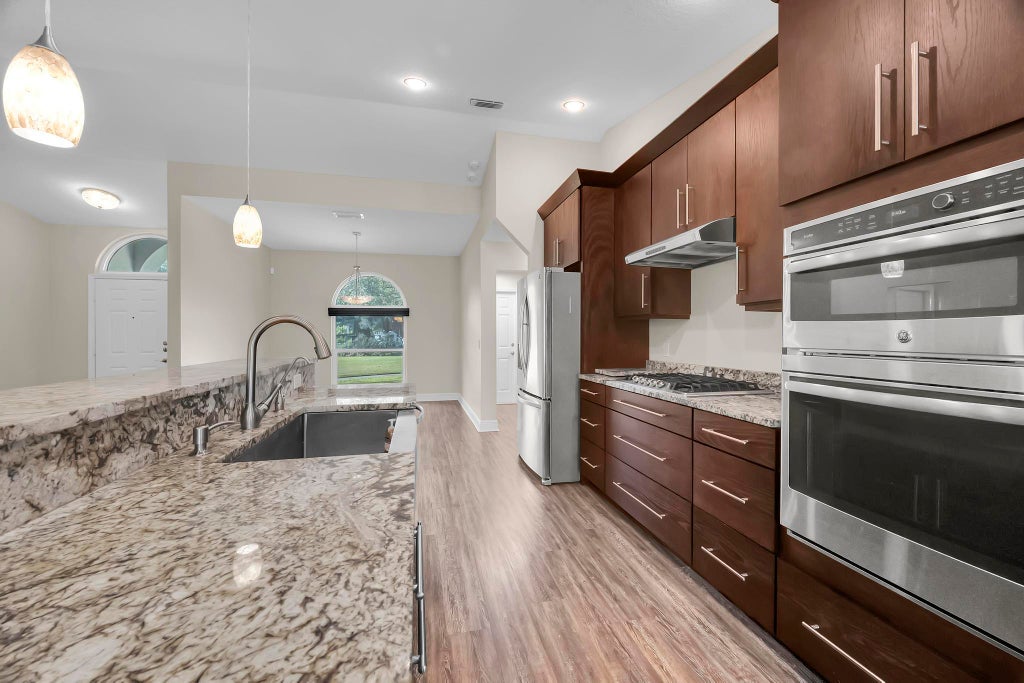 Photo of 8330 Hidden Pines Road, Fort Pierce, FL 34945 (MLS # B26079348)