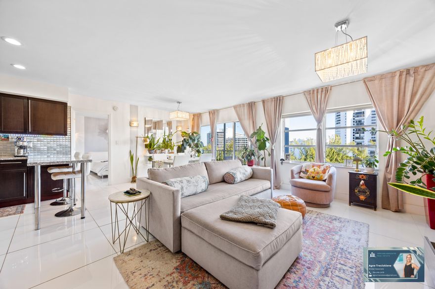 Bright and completely updated 1BR/1.5BA penthouse condo on prestigious Diplomat Parkway with gorgeous Intracoastal and city views! This light-filled home features an easy, open layout that feels spacious and welcoming. The kitchen has been nicely updated with granite countertops and stainless steel appliances, and both bathrooms have been remodeled with a clean, modern look. New porcelain tile flooring runs throughout, adding a fresh and cohesive feel. Step out onto your private balcony to relax and take in the views, plus enjoy the bonus of extra storage. The condo is being sold fully furnished, making it truly move-in ready. The community offers two heated pools, a gym, sauna, sun deck, and even a fishing pier. HOA includes water, cable, internet, and fully funded reserves. All ages welcome and no rentals allowed. Fantastic location close to the beach, Gulfstream, and Aventura Mall -- a great place to call home!