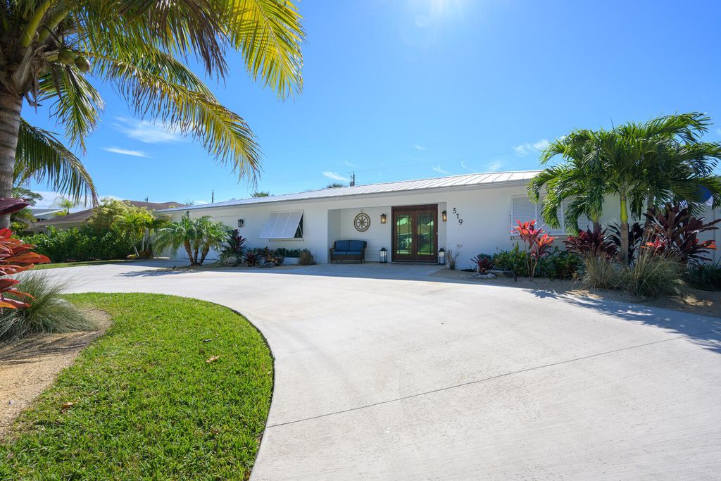 Photo of 319 Country Club Drive, Tequesta, FL 33469 (MLS # R10957514)