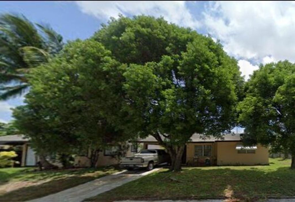 Photo of 516 Wright Drive, Lake Worth Beach, FL 33461 (MLS # R10966589)