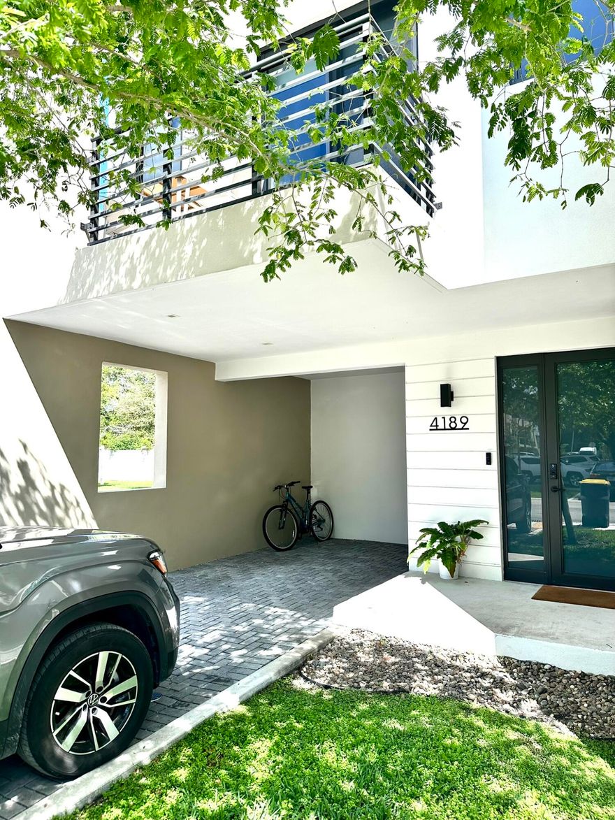 This is a true perk! Stunning corner-unit townhome located in the brand-new gated community of Oaks Place. This bright and spacious home features 3/2.5 and a carport. Tons of natural light flow throughout the home through impact windows and doors, complemented by high-volume ceilings and an open-concept layout.  The home features S/S appliances, custom closets, and a separate laundry room with washer and dryer. Enjoy a private patio and a beautiful second-floor balcony, perfect for relaxing or entertaining.  Community amenities are just steps away and include a clubhouse, pool, gym, and entertainment area. Prime location close to major highways, shopping centers, FLL Airport, Seminole Hard Rock Hotel & Casino Hollywood, Dania Pointe, and minutes to the beach