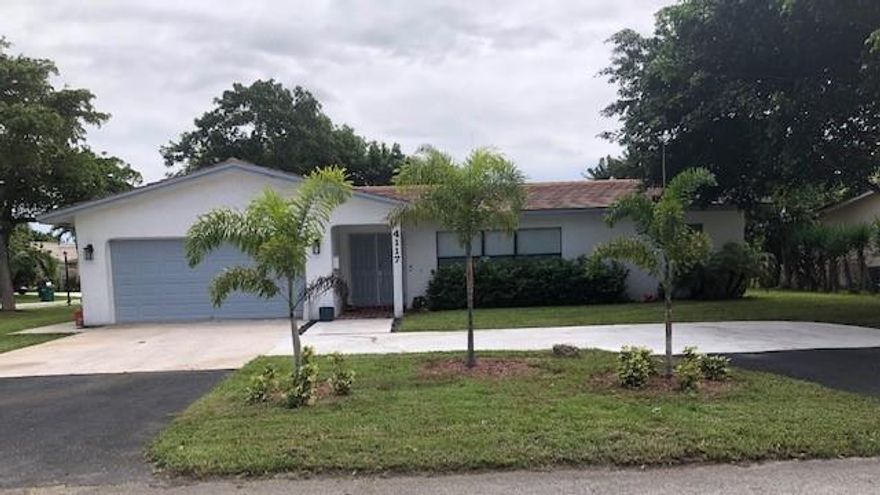 A beautiful 3/2 Ranch home, recently renovated on a large wooded corner lot over 1/4 acre.  Quartz countertops tops complement the kitchen renovation.  Impact Patio Sliders open to the enclosed patio and pool deck.  Roof 4 yr old.   laminated and porcelain title throughout home.