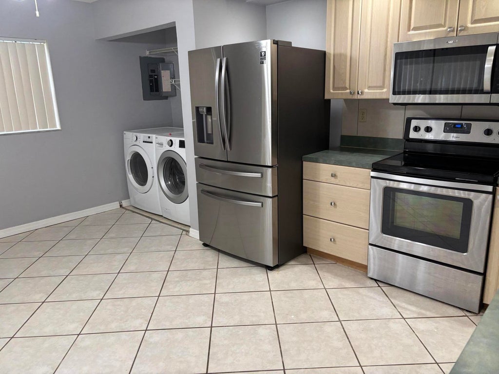 Photo of 352 Prestwick Circle #1, Palm Beach Gardens, FL 33418 (MLS # R11107145)