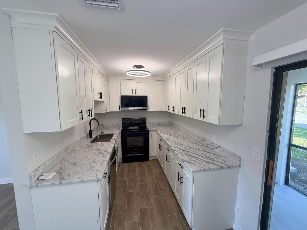 Photo of 440 Glenwood Drive, West Palm Beach, FL 33415 (MLS # R11144170)