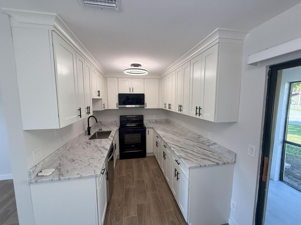 Photo of 440 Glenwood Drive, West Palm Beach, FL 33415 (MLS # R11144170)