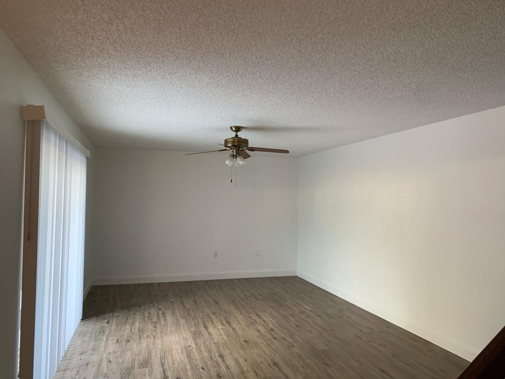 Photo of 5650 SE Windsong Lane #412, Stuart, FL 34997 (MLS # R10976329)