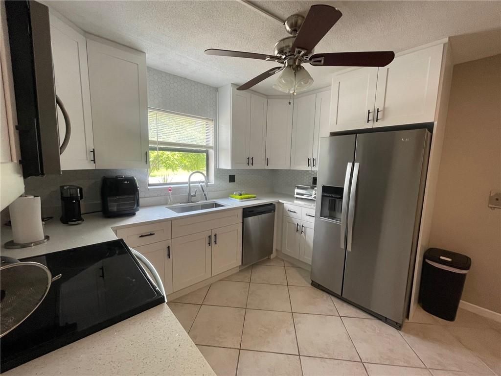 Photo of 255 Sunshine Dr, Coconut Creek, FL 33066 (MLS # F10386148)
