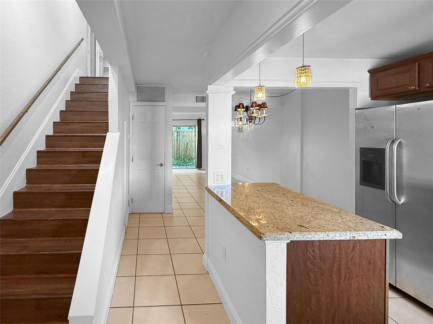 Move-in ready 2 bed, 1½ bath townhouse-style condo in a gated Oakland Park community! This freshly painted home features tile floors downstairs, laminate upstairs, in-unit washer & dryer, and a private fenced patio. Kitchen opens to spacious living/dining area with granite counters and stainless steel appliances. Located directly across from the pool and tennis court — enjoy resort-style living right at your doorstep. One assigned parking space included. Convenient location near shops, dining & major highways.