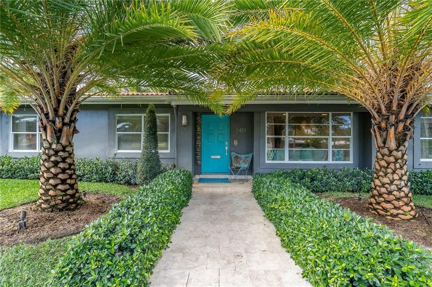 Come home to resort style living in this large corner lot South Coral Heights stunner.  Enjoy indoor/outdoor living in the professionally architected backyard lanai overlooking the saltwater pool. Full custom outdoor stacked stone and granite built in kitchen with sink, Bull grill, and refrigerator. Enclosed outdoor shower off the primary bedroom. The backlit primary bedroom has a dressing area and custom built-in closets. The third bedroom has been converted into an office/media room with custom cabinets. Beautifully tiled eat-in kitchen with colorful Jonathan Adler sink, bar seating, and additional wine fridge. A second full size refrigerator is located in the garage. Lots of closet and storage space. Large circular driveway. Outdoor lighting on all landscaping. Low maintenance lawn.