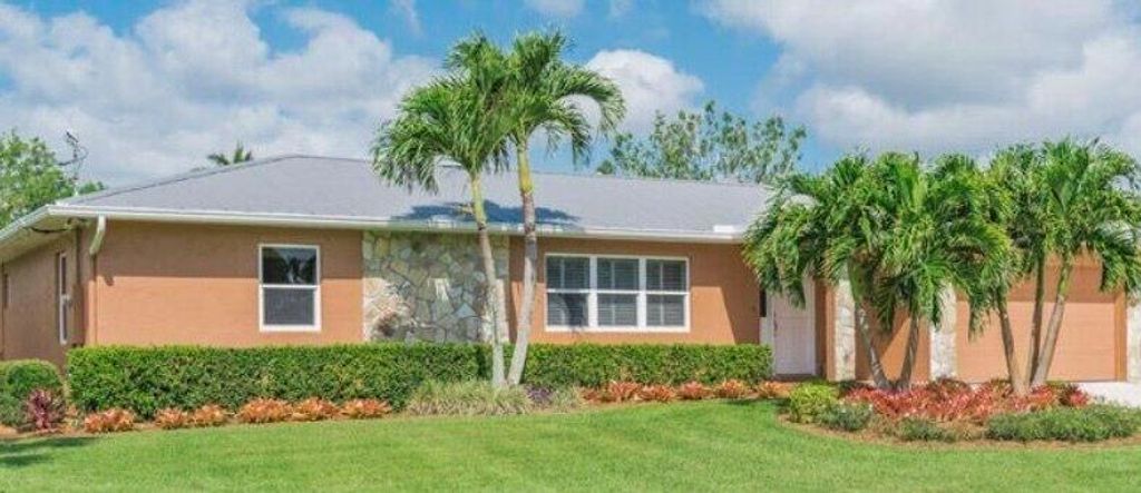 Photo of 2222 SW Riverside Drive, Palm City, FL 34990 (MLS # R10919330)