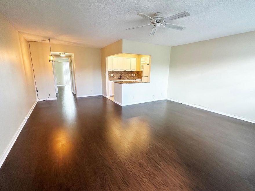 Beautifully Updated 1 Bedroom 1.5 Bathroom condo on the 3rd floor, in the Desirable section of Suffolk. Wood look floors in living/dining & bedroom, updated kitchen with granite countertops, updated vanities and tile floors in bathrooms. Century Village is a 55+ community with guard gated security and features abundant amenities including first class shows, bus service, bike paths, billiards, full gym and more !! Close to dining and shopping and house of worship. Washing machines, elevator and locker are steps away ! Association fees include water, sewer, trash, cable, internet-WIFI.