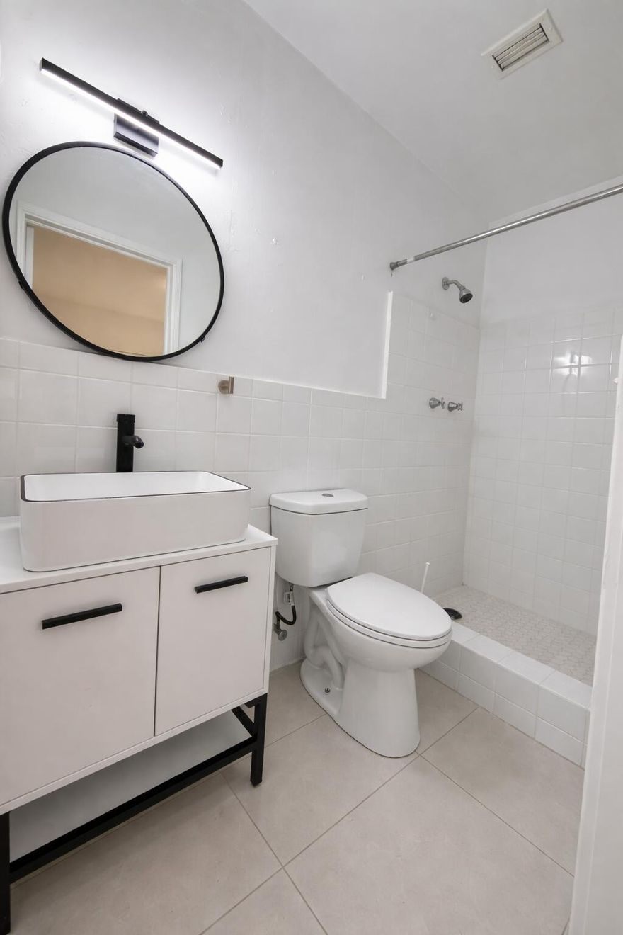 Welcome to Rascal Hollywood LLC, offering a spacious and beautifully updated 3 bedroom, 2 bathroom residence in the heart of East Hollywood. This unit features a large open living and dining area along with a fully updated kitchen, perfect for comfortable everyday living. Enjoy beautiful porcelain tile flooring throughout and remodeled bathrooms with modern finishes. Designed to feel more like a private home, the unit includes both front & back entrance, with rear leading out to the patio area, ideal for relaxing or entertaining. Conveniently located in East Hollywood, close to major highways. shopping, and schools. The property also includes two assigned parking spaces for added convenience. A great opportunity for those looking for space, style and location.